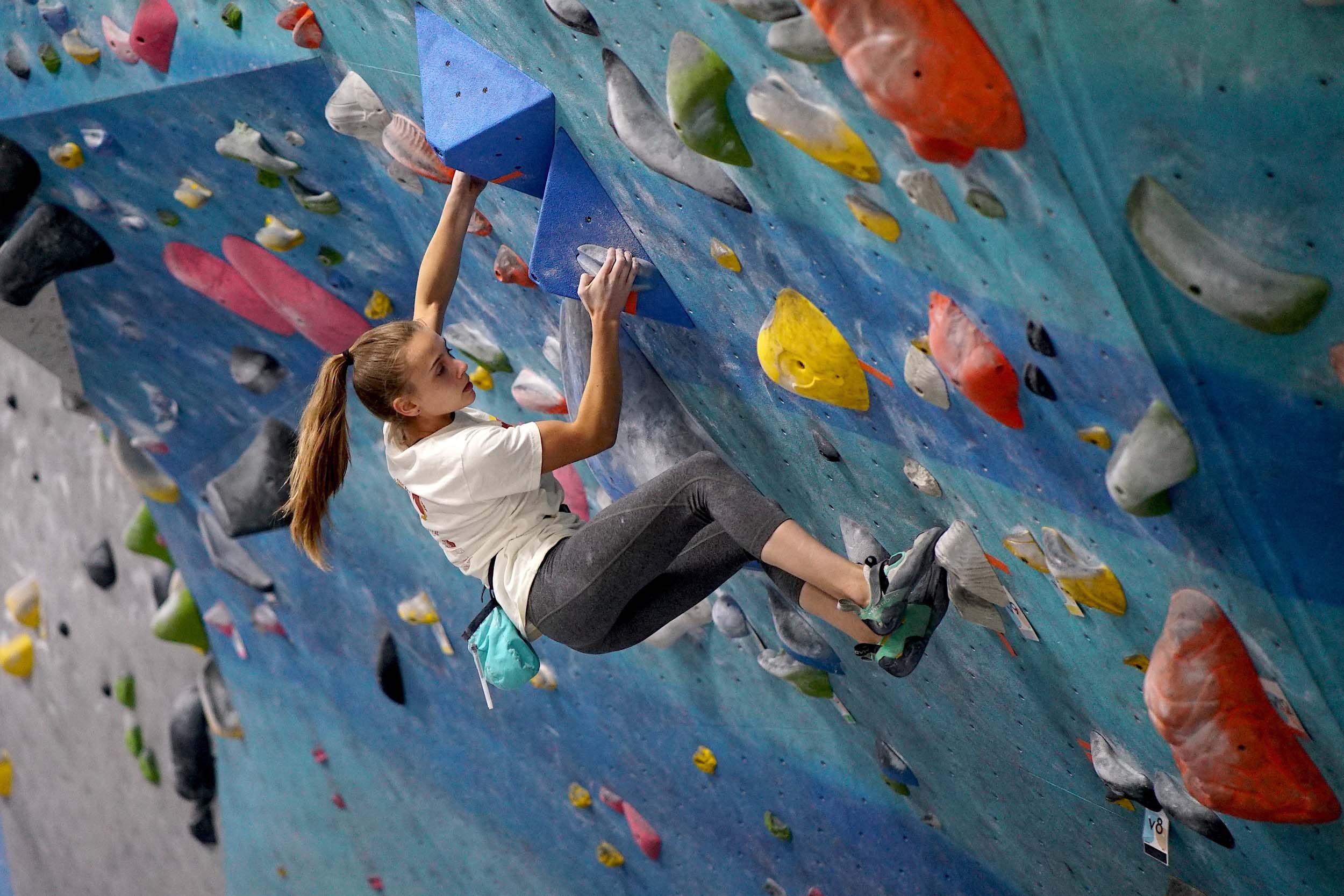 Indoor bouldering with shoes.